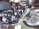 Attachment of a swing arm, a drive shaft, and a silencer